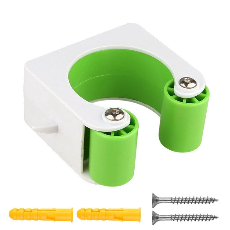 Green bicycle parking clip with mounting screws and wall plugs on white background