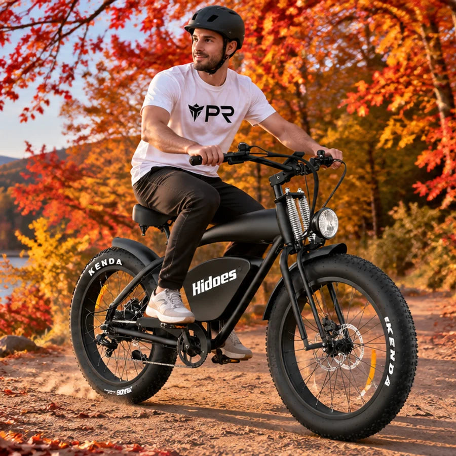 A helmeted rider wearing a white Punk Ride logo T-shirt rides the HIDOES B3 Electric Bike in an autumn setting. Mobile collection banner.