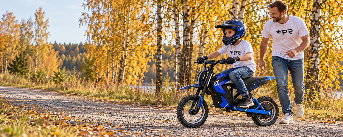 A helmeted child rides a blue KOOLUX EV12M kids electric bike beside an adult in white Punk Ride logo T-shirts on an autumn woodland path.