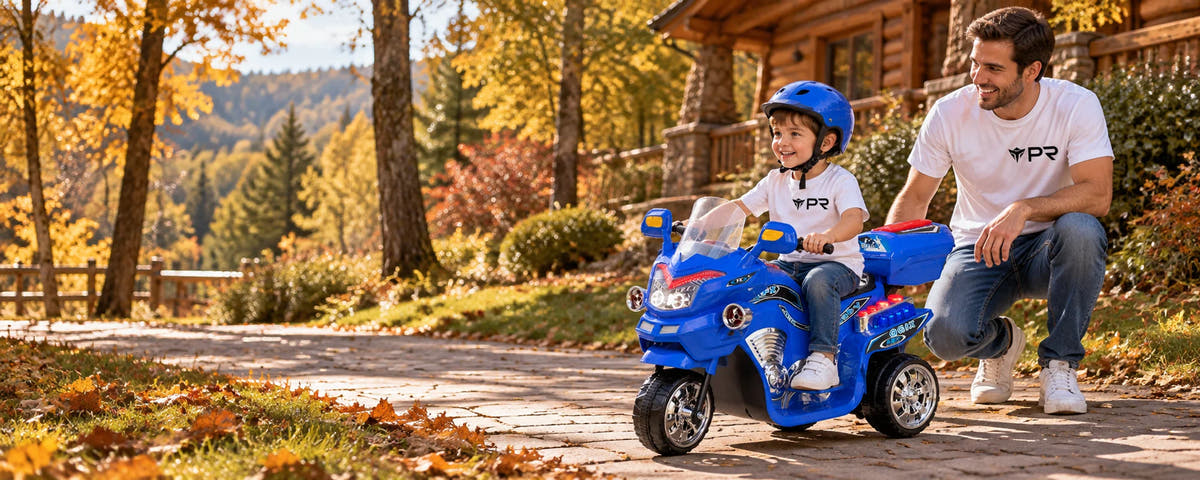 A helmeted child uses a blue three-wheel electric ride-on toy beside an adult in white Punk Ride logo T-shirts on an autumn woodland path.