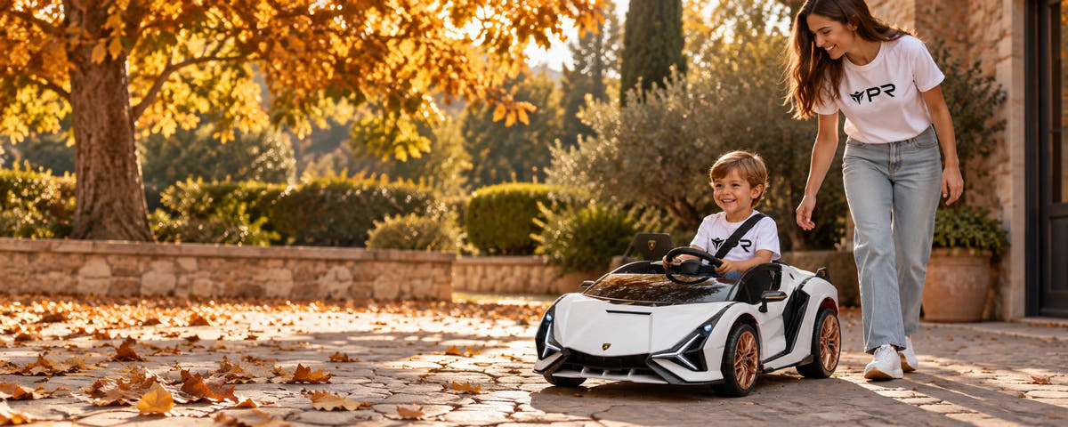 A child drives a white Lamborghini Sian ride-on toy beside an adult in white Punk Ride logo T-shirts in an autumn courtyard.