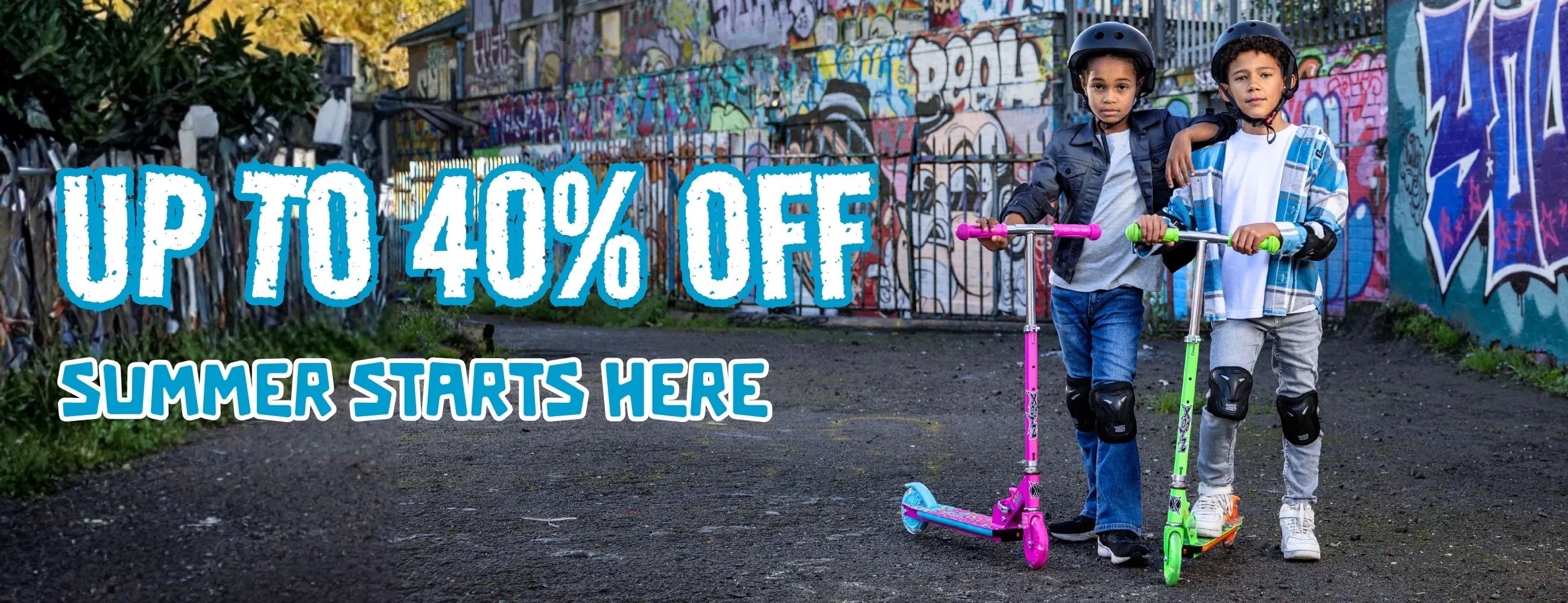 Two children with scooters in front of a graffiti-covered wall, with promotional text overlay.