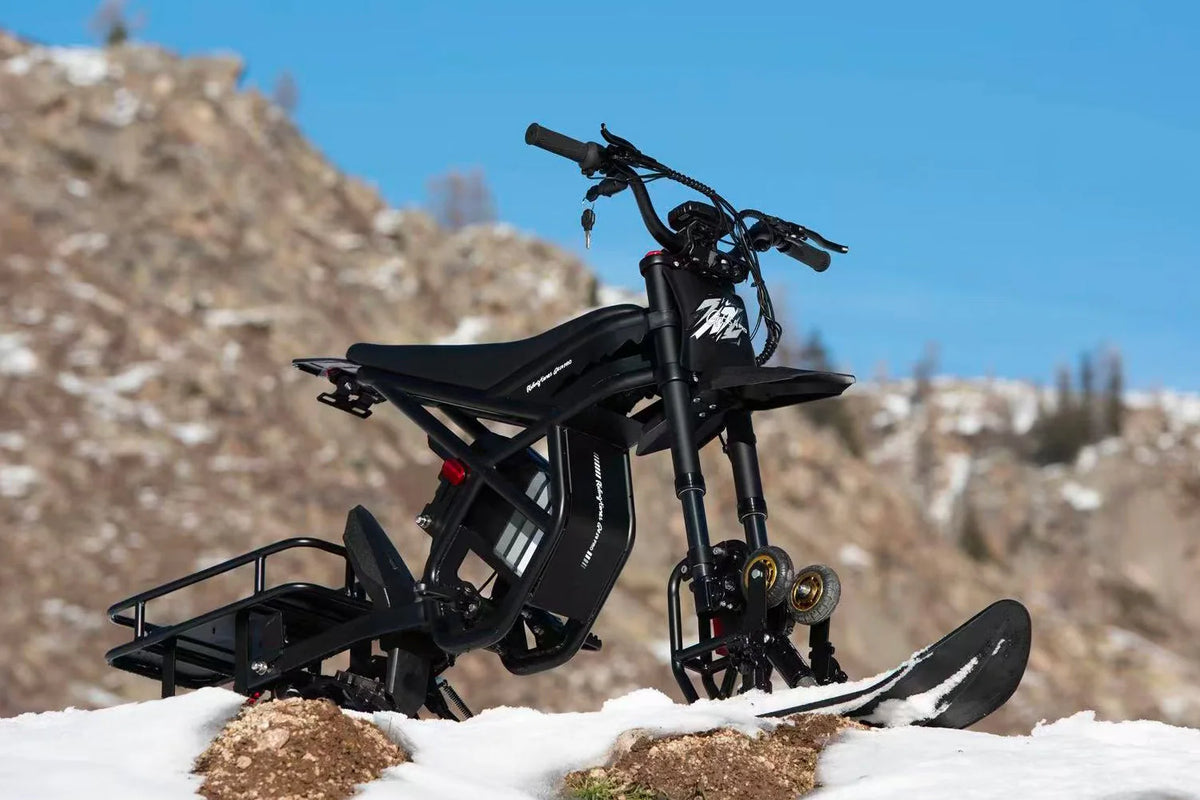 Riding Times GT54 Pro black electric dirt bike, parked outdoors in snow