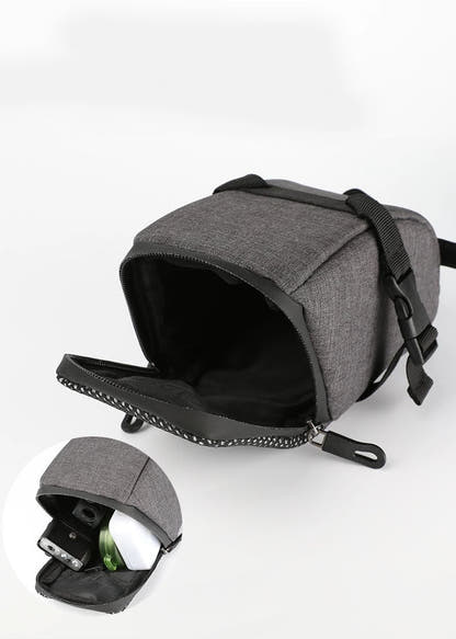 Grey bicycle saddle bag open with removable rear-light unit