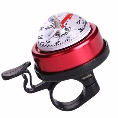 Red bicycle bell with built-in compass on white background