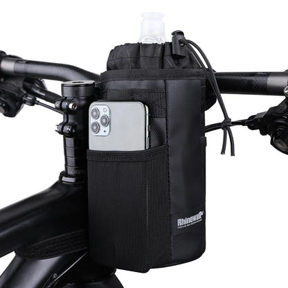 Black bottle bag installed at bicycle handlebars with front pocket visible