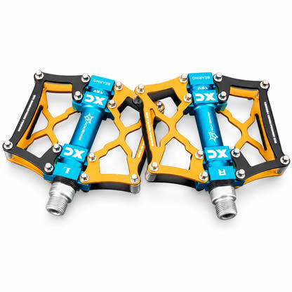 Yellow bicycle platform pedal pair on white background