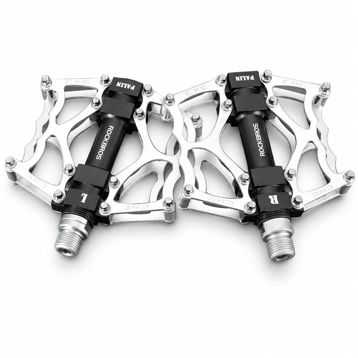 Silver bicycle platform pedal pair on white background