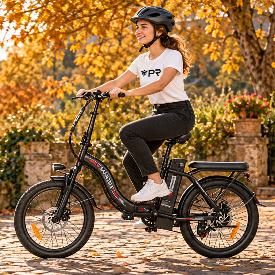A helmeted rider wearing a white Punk Ride logo T-shirt rides the SAMEBIKE CY20 Portable Electric Bike in an autumn setting. Mobile collection banner.