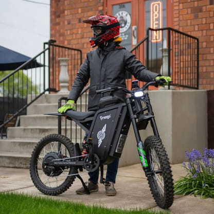 Freego X3 Pro electric dirt bike, front view in an urban setting