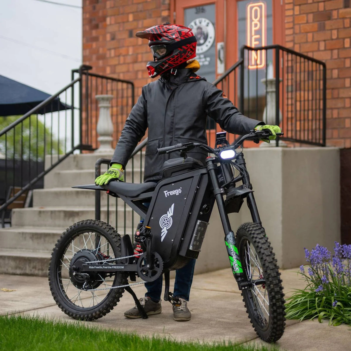 Freego X3 Pro electric dirt bike, front view in an urban setting