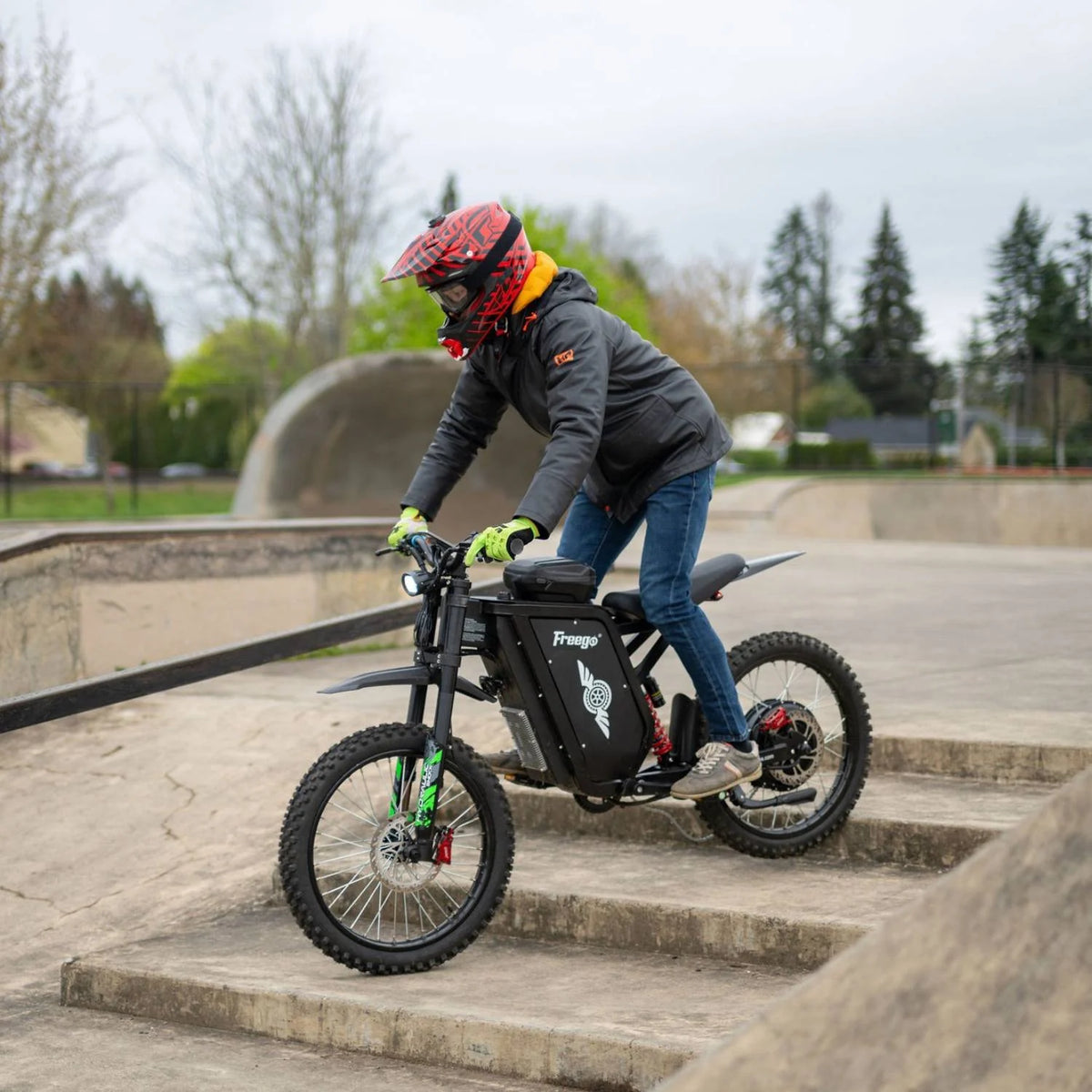 Rider using a Freego X3 Pro electric dirt bike in a skatepark setting