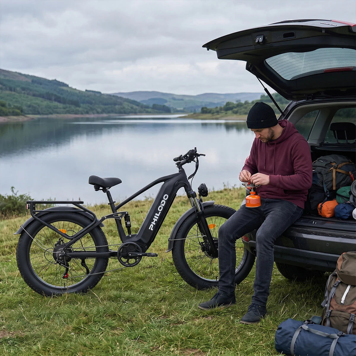 PHILODO Falcon Step-Over Black electric bike beside a lake