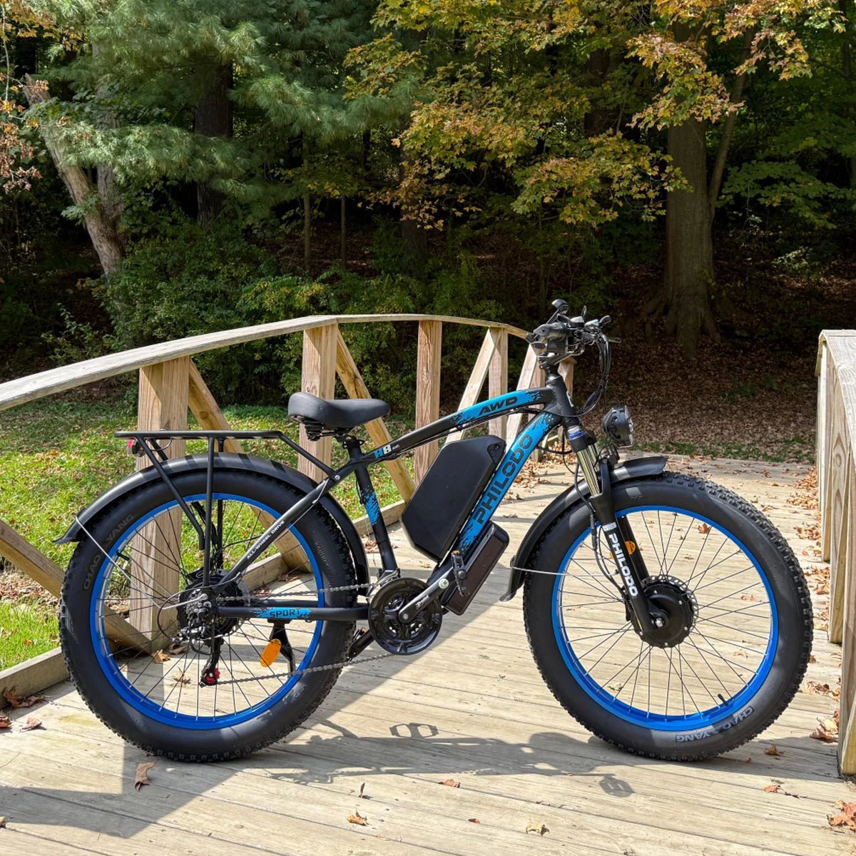 PHILODO H8 Blue electric bike beside a woodland path