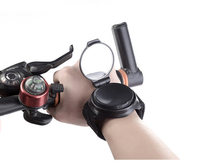 Black wrist mirror shown worn while holding a bicycle handlebar