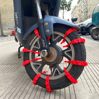 Red nylon tyre straps installed on a scooter tyre; fitting reference